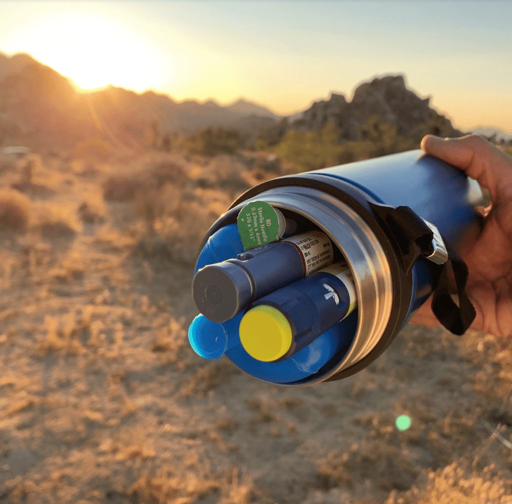 4AllFamily Australia Explorer Insulin Cooler Picture taken in the desert showing 2 insulin pens